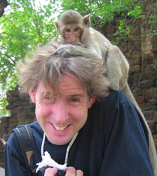 Ian Lloyd, being harassed by a monkey with a hair fetish